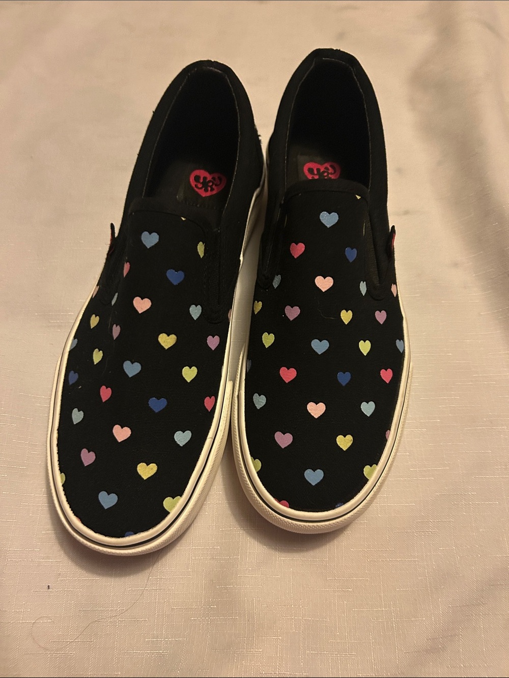 Kids Black Slip-On Sneakers with Multicolor Heart Print